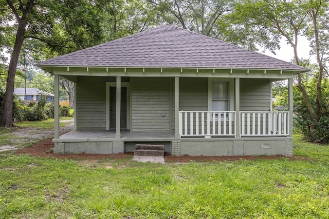 5855 Morningside Dr, Columbus, GA 31909 - view of front facade with roof with shingles, covered porch, and a front yard