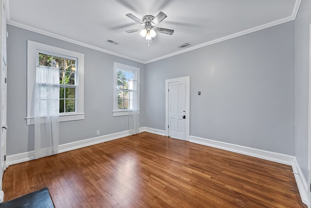 spare room with ceiling fan, hardwood / wood-style floors, and crown molding