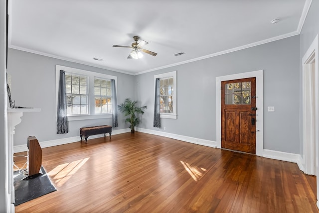 unfurnished room with ceiling fan, hardwood / wood-style floors, and ornamental molding