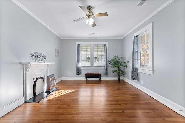 unfurnished room featuring crown molding, ceiling fan, and hardwood / wood-style flooring