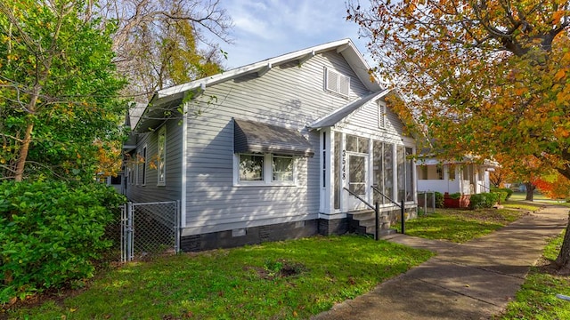 view of side of home featuring a yard