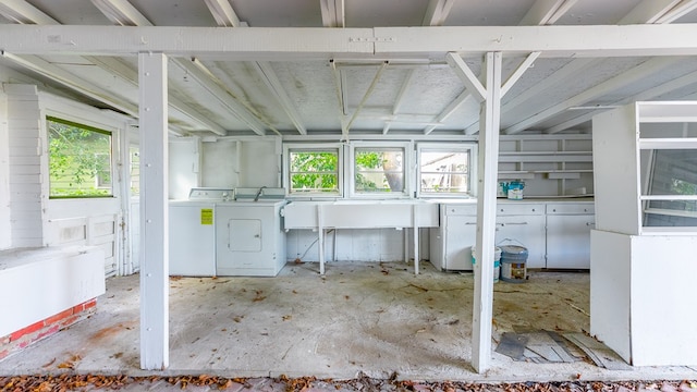 basement with washer and clothes dryer