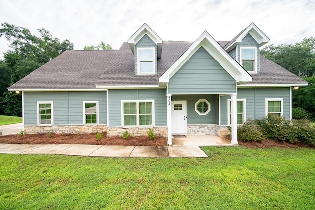 402 Lee Road 2203, Phenix City, AL 36870 - view of front facade featuring a shingled roof, a front yard, and stone siding