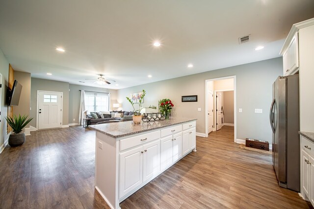 402 Lee Road 2203, Phenix City, AL 36870 - kitchen with freestanding refrigerator, a center island, ceiling fan, white cabinetry, and recessed lighting