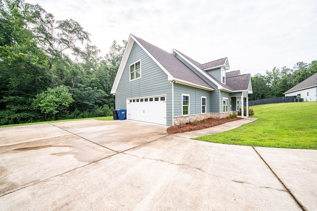402 Lee Road 2203, Phenix City, AL 36870 - view of side of home featuring driveway, an attached garage, roof with shingles, and stone siding
