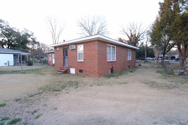 view of home's exterior featuring an AC wall unit