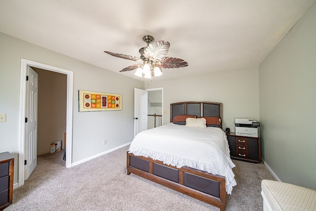 carpeted bedroom with baseboards and ceiling fan