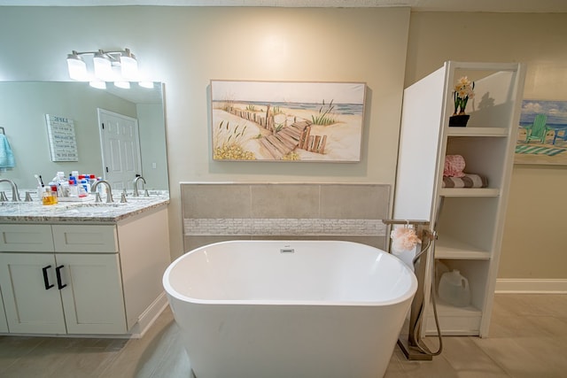 bathroom with double vanity, a sink, and a soaking tub