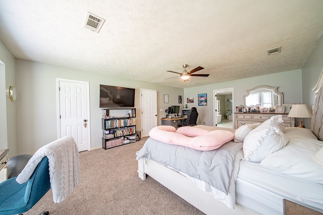 bedroom with light carpet, a ceiling fan, a textured ceiling, and visible vents
