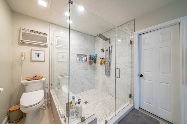 full bathroom featuring an AC wall unit, a marble finish shower, and toilet