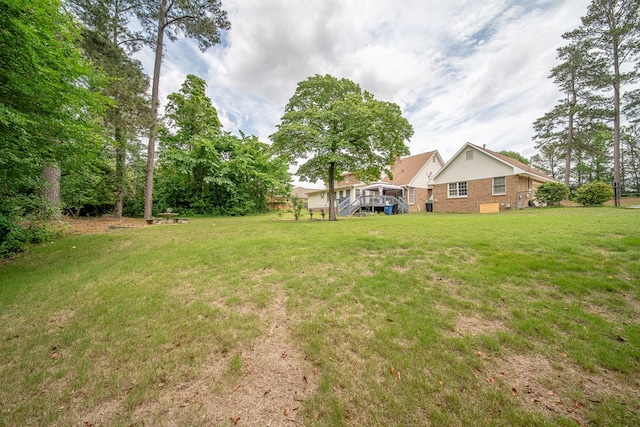 view of yard featuring a deck