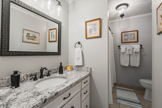 full bath with crown molding, vanity, tile patterned flooring, toilet, and baseboards