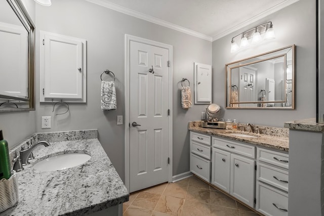 full bathroom with ornamental molding and two vanities