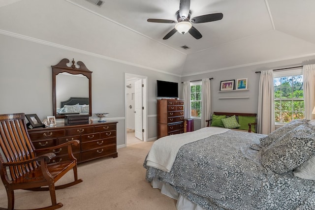 carpeted bedroom featuring vaulted ceiling, ceiling fan, and connected bathroom