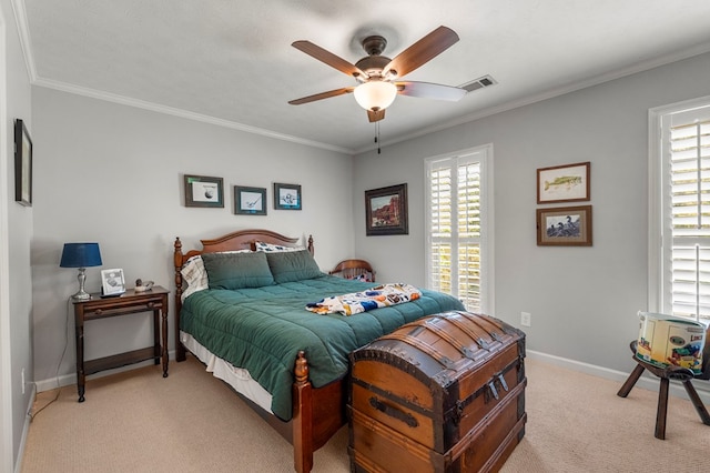 bedroom with light colored carpet, multiple windows, baseboards, and crown molding