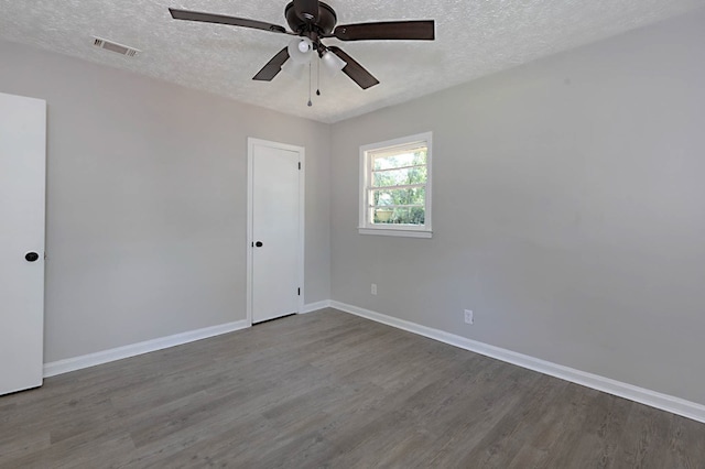 3122 Glenwood Dr, Columbus, GA 31906 - empty room featuring a textured ceiling, dark wood-type flooring, and ceiling fan