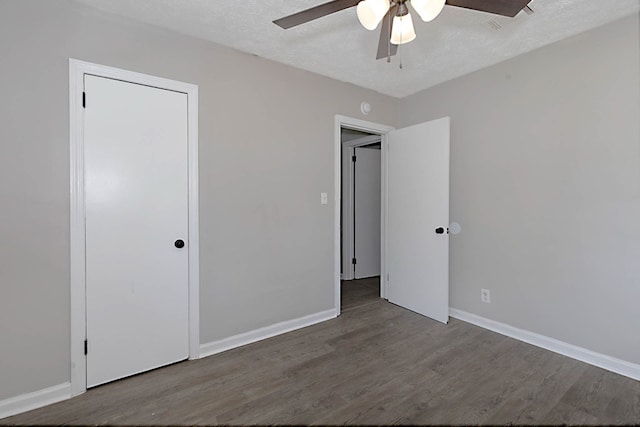 3122 Glenwood Dr, Columbus, GA 31906 - unfurnished bedroom with wood finished floors, ceiling fan, and a textured ceiling