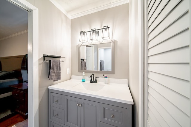 5728 Lexington Dr, Columbus, GA 31907 - bathroom featuring crown molding, vanity, and wood finished floors