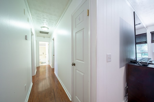 5728 Lexington Dr, Columbus, GA 31907 - corridor with wood-type flooring, a textured ceiling, and crown molding