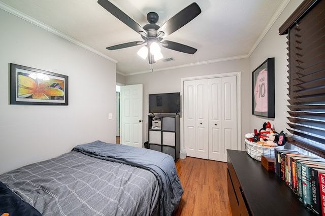 5728 Lexington Dr, Columbus, GA 31907 - bedroom with wood finished floors, ornamental molding, a closet, and a ceiling fan