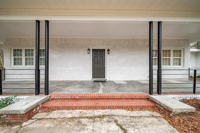 doorway to property with a porch