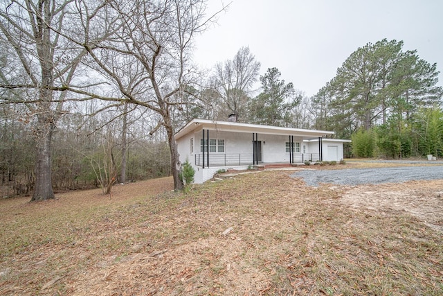 view of front of home with a garage and covered porch