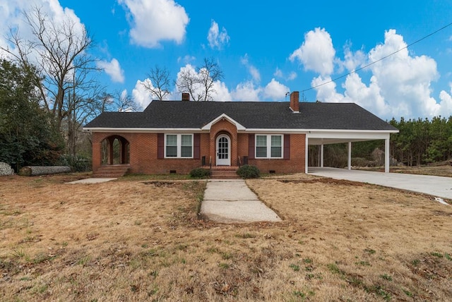 ranch-style house with driveway, brick siding, crawl space, a carport, and a front yard