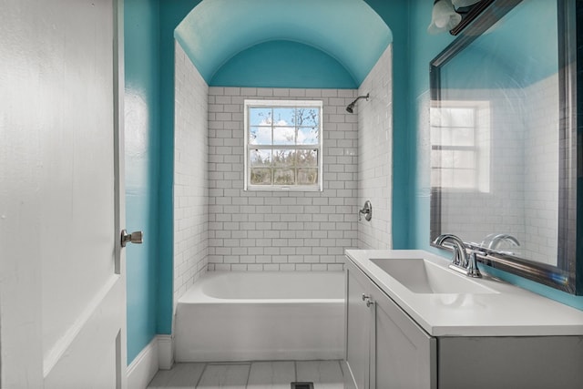 bathroom with tile patterned flooring, vanity, and shower / bathtub combination