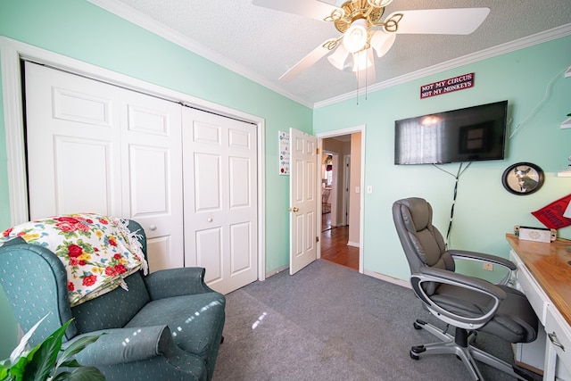 home office featuring carpet floors, ornamental molding, a textured ceiling, and ceiling fan