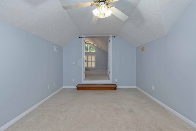 767 River Oaks Ct, Columbus, GA 31904 - bonus room featuring lofted ceiling, a textured ceiling, carpet flooring, and a ceiling fan