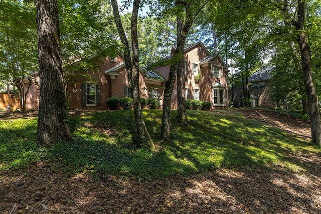 767 River Oaks Ct, Columbus, GA 31904 - view of front of house featuring brick siding and a front lawn