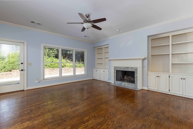 767 River Oaks Ct, Columbus, GA 31904 - unfurnished living room featuring built in features, a ceiling fan, a high end fireplace, dark wood-type flooring, and ornamental molding