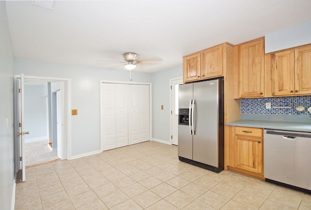 5622 Pollman St, Columbus, GA 31907 - kitchen featuring appliances with stainless steel finishes, ceiling fan, tasteful backsplash, light countertops, and light tile patterned floors