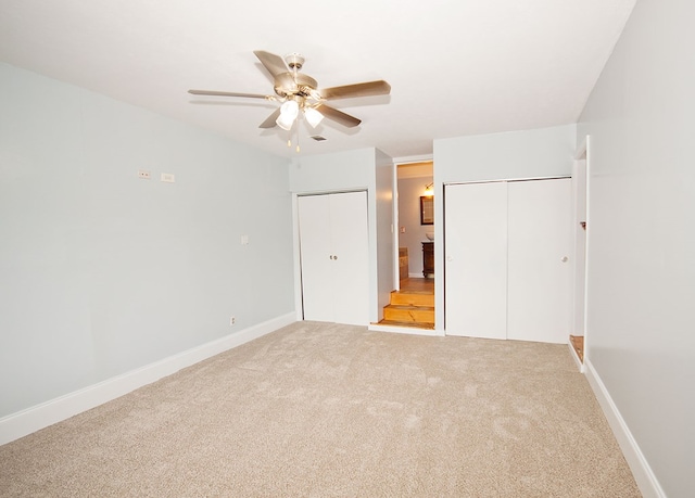 5622 Pollman St, Columbus, GA 31907 - unfurnished bedroom with two closets, light colored carpet, and ceiling fan