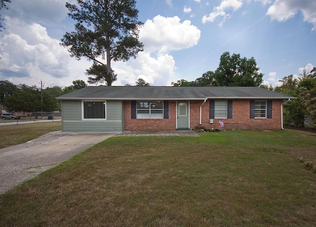 5622 Pollman St, Columbus, GA 31907 - ranch-style home featuring brick siding, a front yard, and concrete driveway