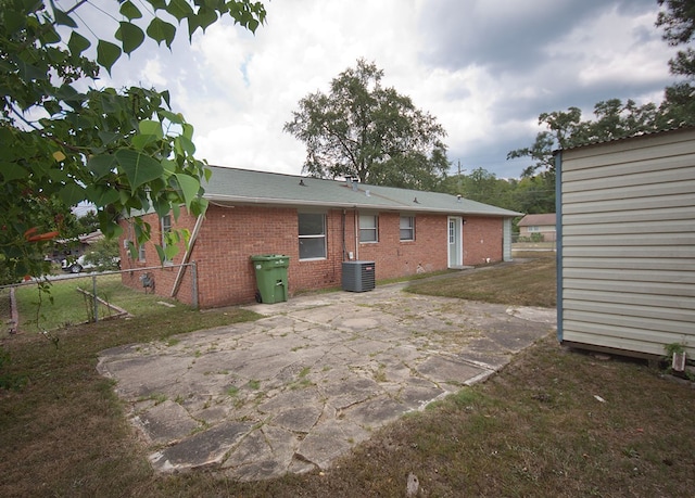 5622 Pollman St, Columbus, GA 31907 - back of property featuring brick siding, a patio area, and roof with shingles