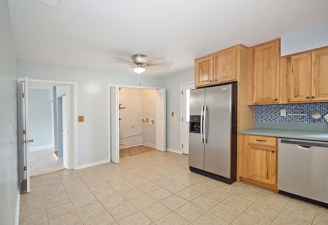 5622 Pollman St, Columbus, GA 31907 - kitchen featuring appliances with stainless steel finishes, ceiling fan, tasteful backsplash, light countertops, and light tile patterned flooring