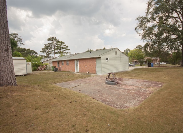5622 Pollman St, Columbus, GA 31907 - view of green lawn featuring a storage unit