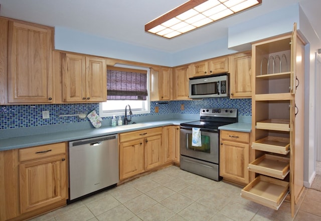 5622 Pollman St, Columbus, GA 31907 - kitchen featuring stainless steel appliances, open shelves, tasteful backsplash, light tile patterned floors, and light brown cabinetry