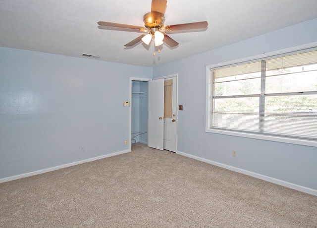 5622 Pollman St, Columbus, GA 31907 - empty room with light carpet and a ceiling fan