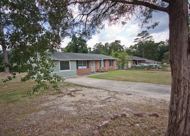 5622 Pollman St, Columbus, GA 31907 - single story home featuring a front lawn, brick siding, and concrete driveway
