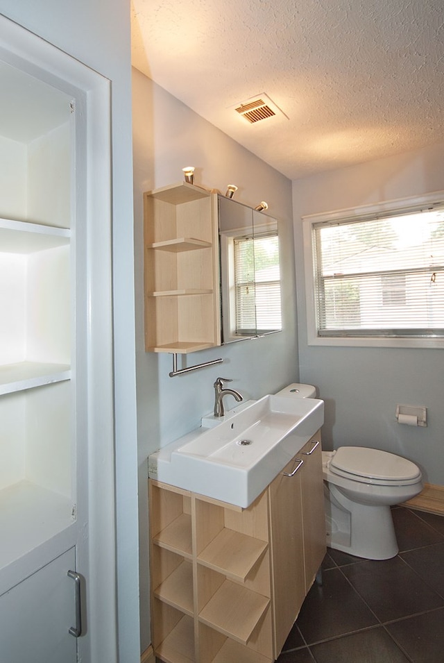 5622 Pollman St, Columbus, GA 31907 - bathroom featuring vanity, tile patterned floors, and a textured ceiling
