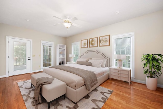 bedroom with access to outside, ceiling fan, and light hardwood / wood-style floors