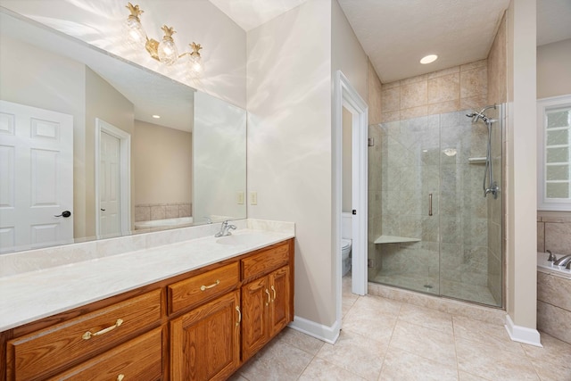 full bathroom with vanity, a textured ceiling, tile patterned flooring, shower with separate bathtub, and toilet