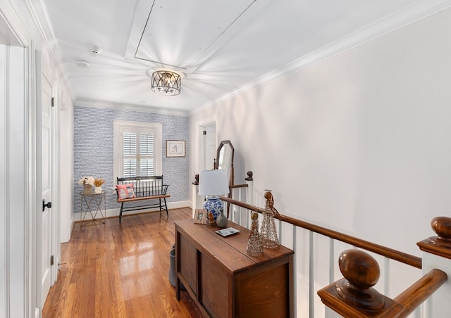 corridor with light wood-type flooring, wallpapered walls, baseboards, and crown molding