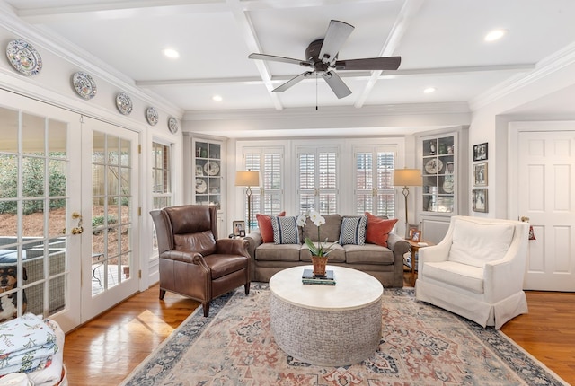 living room featuring french doors, crown molding, wood finished floors, coffered ceiling, and beamed ceiling