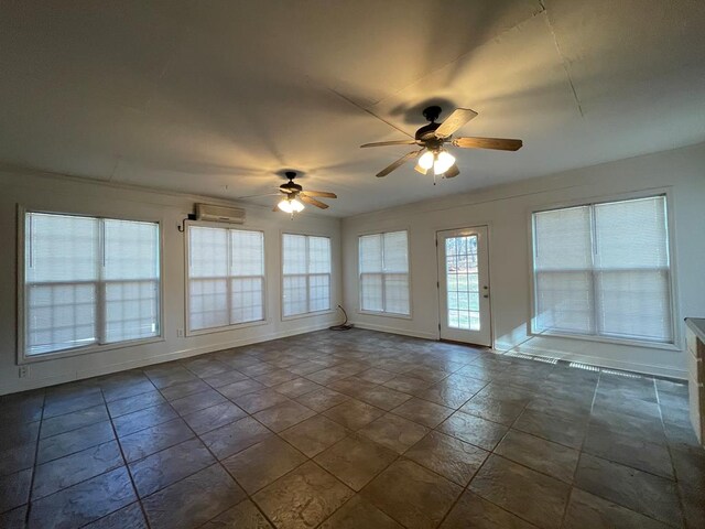 clothes washing area with visible vents, baseboards, washer hookup, cabinet space, and dark tile patterned flooring