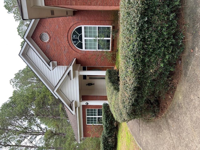 exterior space featuring brick siding