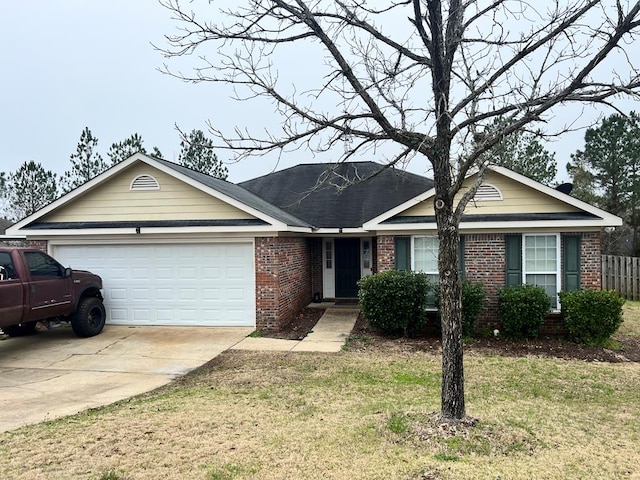 ranch-style house featuring a garage and a front yard