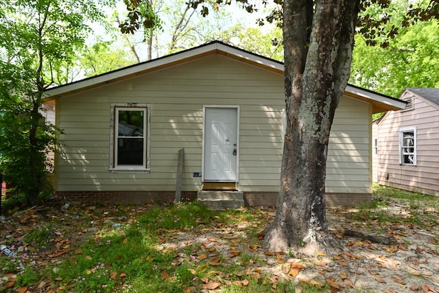 rear view of property with entry steps